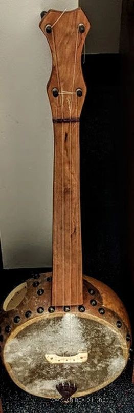 Osner created this banjolele from a large gourd.jpg